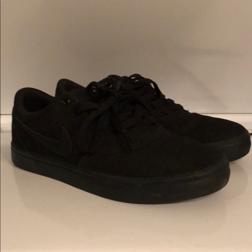All black Nike shoes